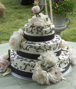 3 layer cake with scroll artwork